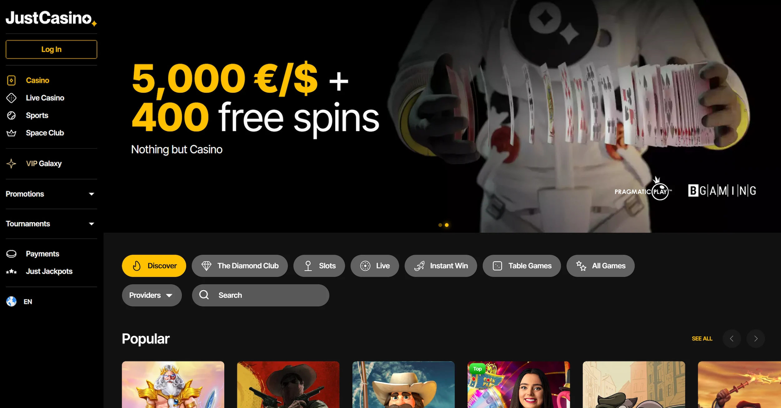 JustCasino frontpage featuring welcome bonus offer, selection of online pokies and site navigation